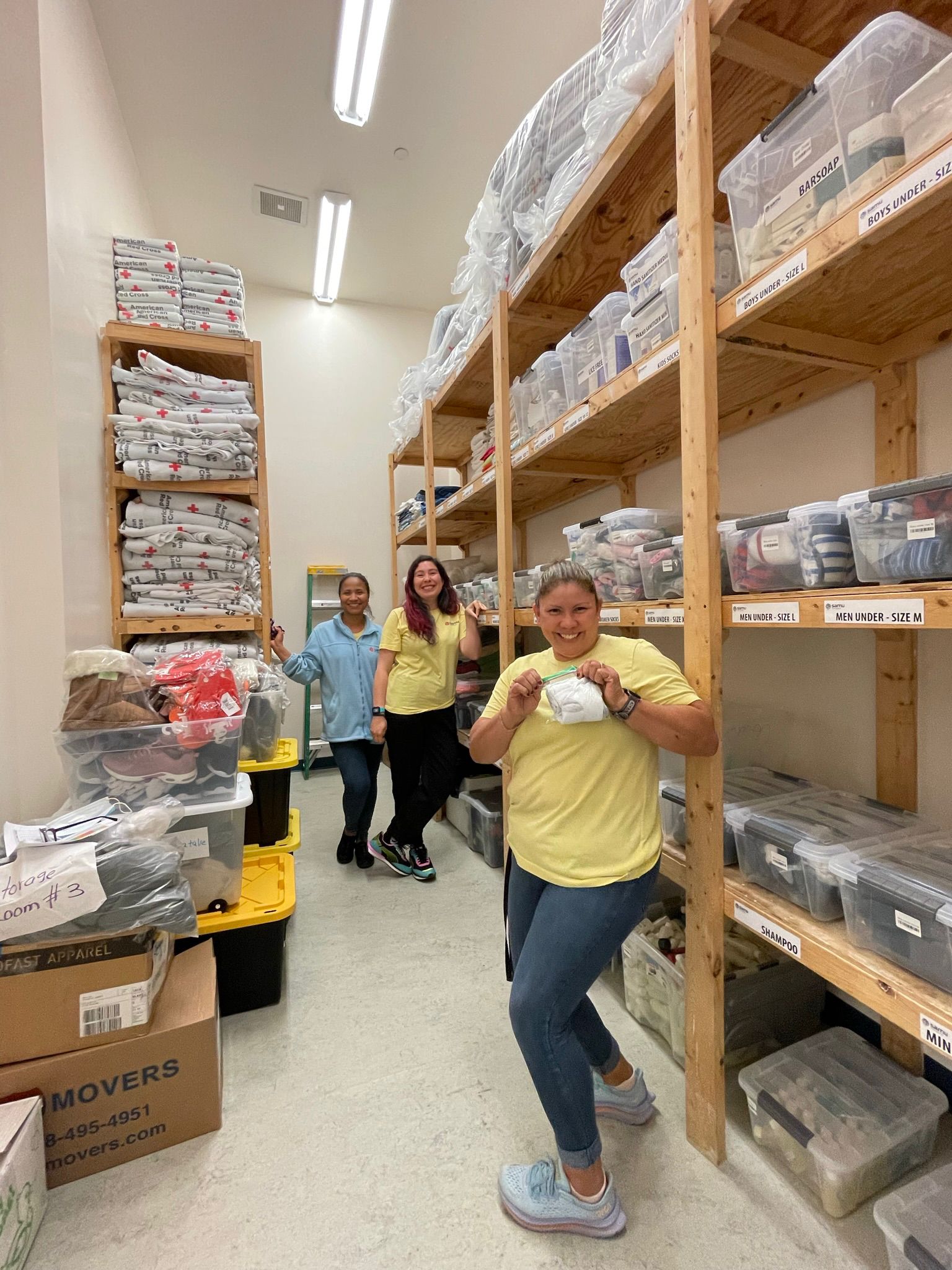 Members of the SAMU First Response Logistics and Service teams work on inventory of supplies donated by partners and the community to welcome newcomers arriving in the nation's capitol.